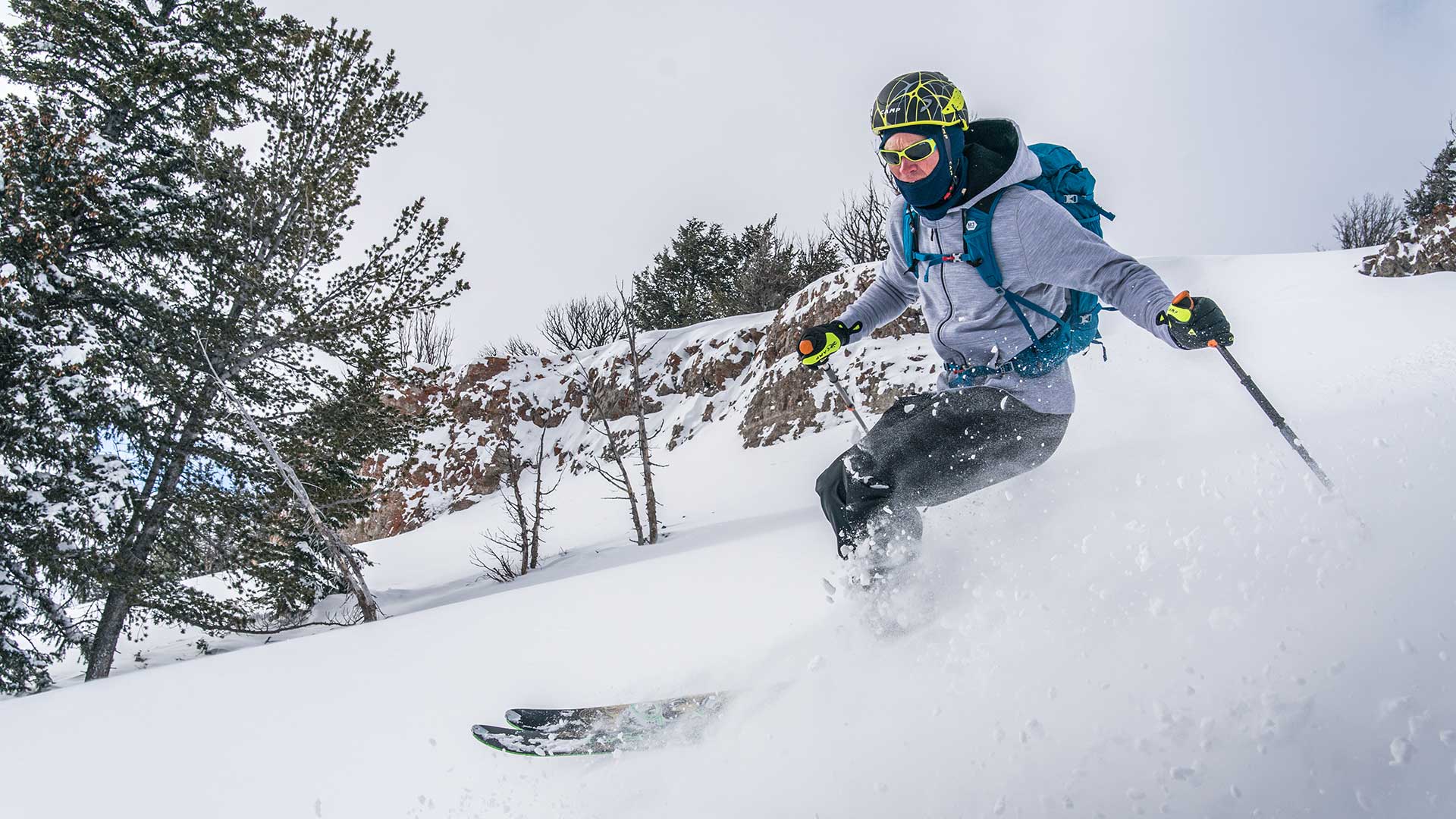 man skiing while wearing minus33 merino wool expedition weight hoodie sweatshirt