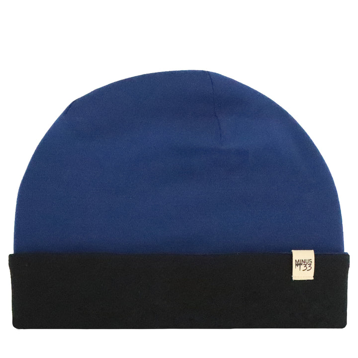 Flat lay image of the ridge cuff beanie. The color is navy blue and the cuff is black. 