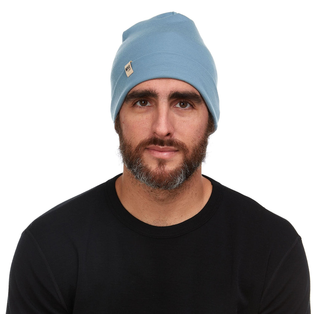 A man models the lightweight, double-layered, hundred percent, super soft merino wool beanie perfect for fall, winter, and spring. This hat is perfect for a hike up the mountain or a walk around the block!
#color_slate-blue