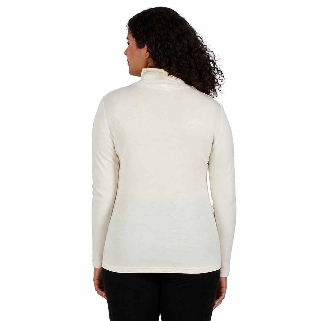 a cream-colored turtleneck sweater and black pants, merino wool 