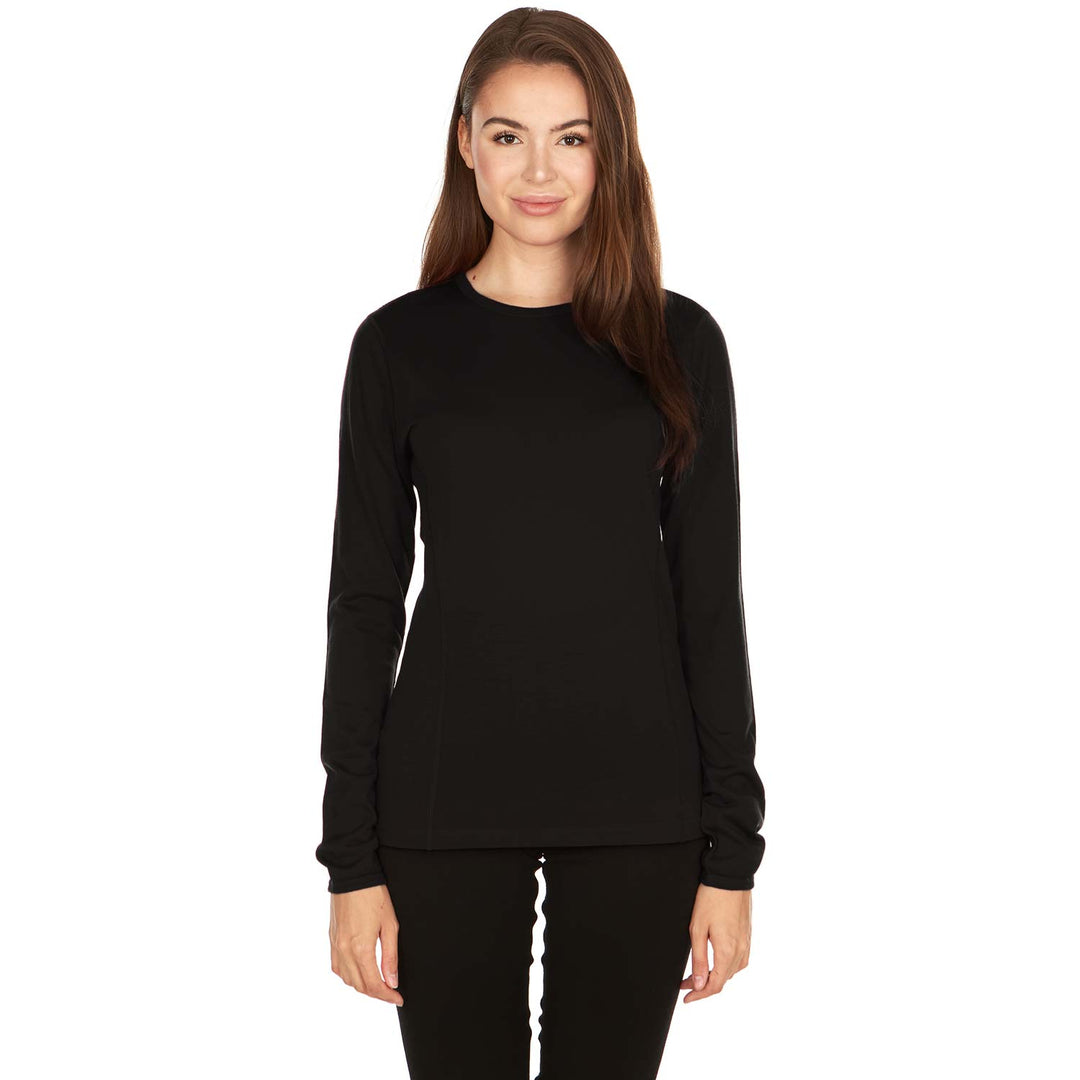 Woman wearing a thin breathable black long-sleeve merino top on a white background