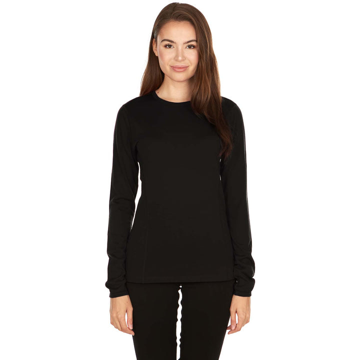 Woman wearing a thin breathable black long-sleeve merino top on a white background