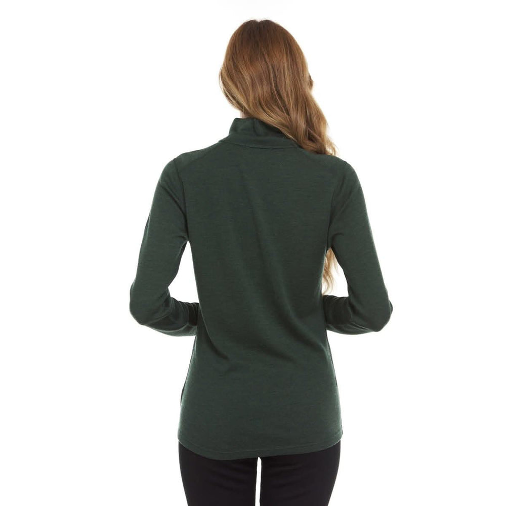 A woman models a comfortable women's midweight quarter zip sweater in a soft merino wool. The sweater features a 1/4 zip neckline and thumbholes at the cuffs #color_forest-green