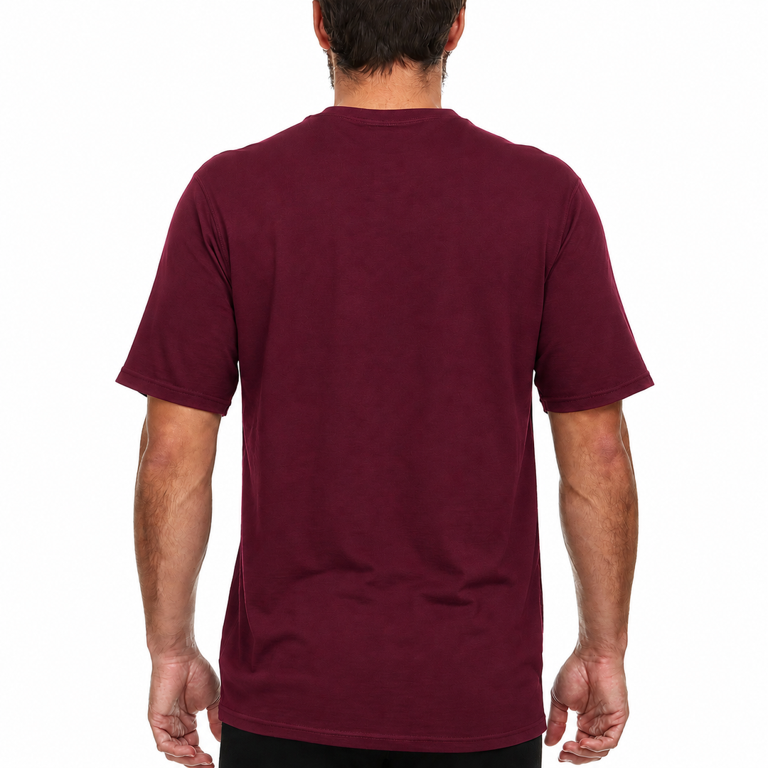 A man models a super soft, short sleeved merino wool t shirt. Use it as a base layer under your work shirt, or wear it all by itself during your next summer summit. 