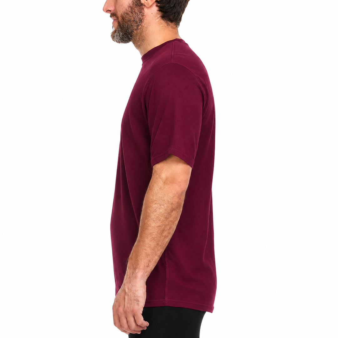 A man models a super soft, short sleeved merino wool t shirt. Use it as a base layer under your work shirt, or wear it all by itself during your next summer summit. 