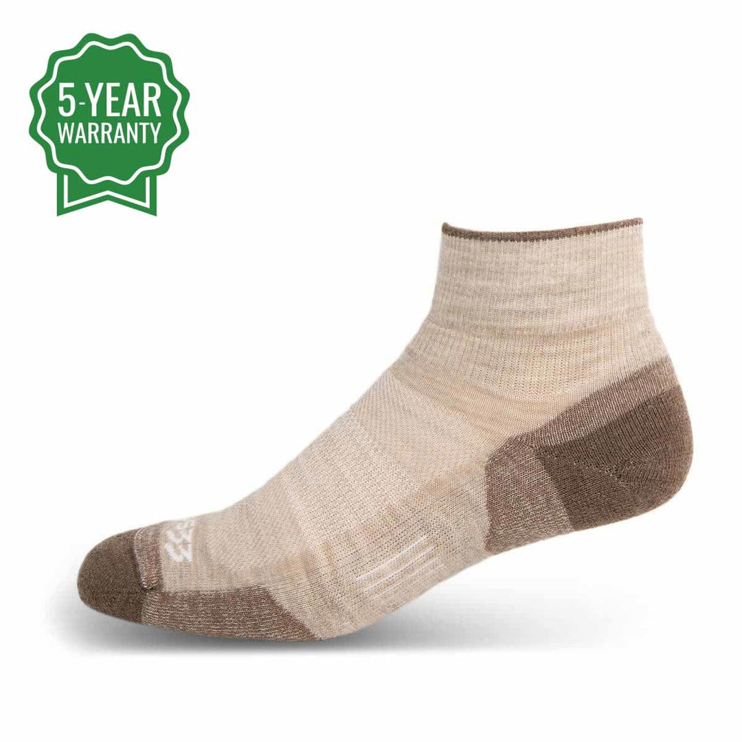 Mountain Heritage Micro Weight Full Cushion Ankle Socks Oatmeal. With over the ankle coverage, the Mountain Heritage Micro Weight Full Cushion Ankle Socks are everything you look for in a low profile wool sock. Fitted with a Y-heel style that provides a perfect pocket for your heel, and 3-Zone Elastic technology, this sock will stay snug on your feet. While keeping dirt and grime at bay, your feet will stay aired out and cool due to the venting technology fixated on the top of the sock. #color_oatmeal