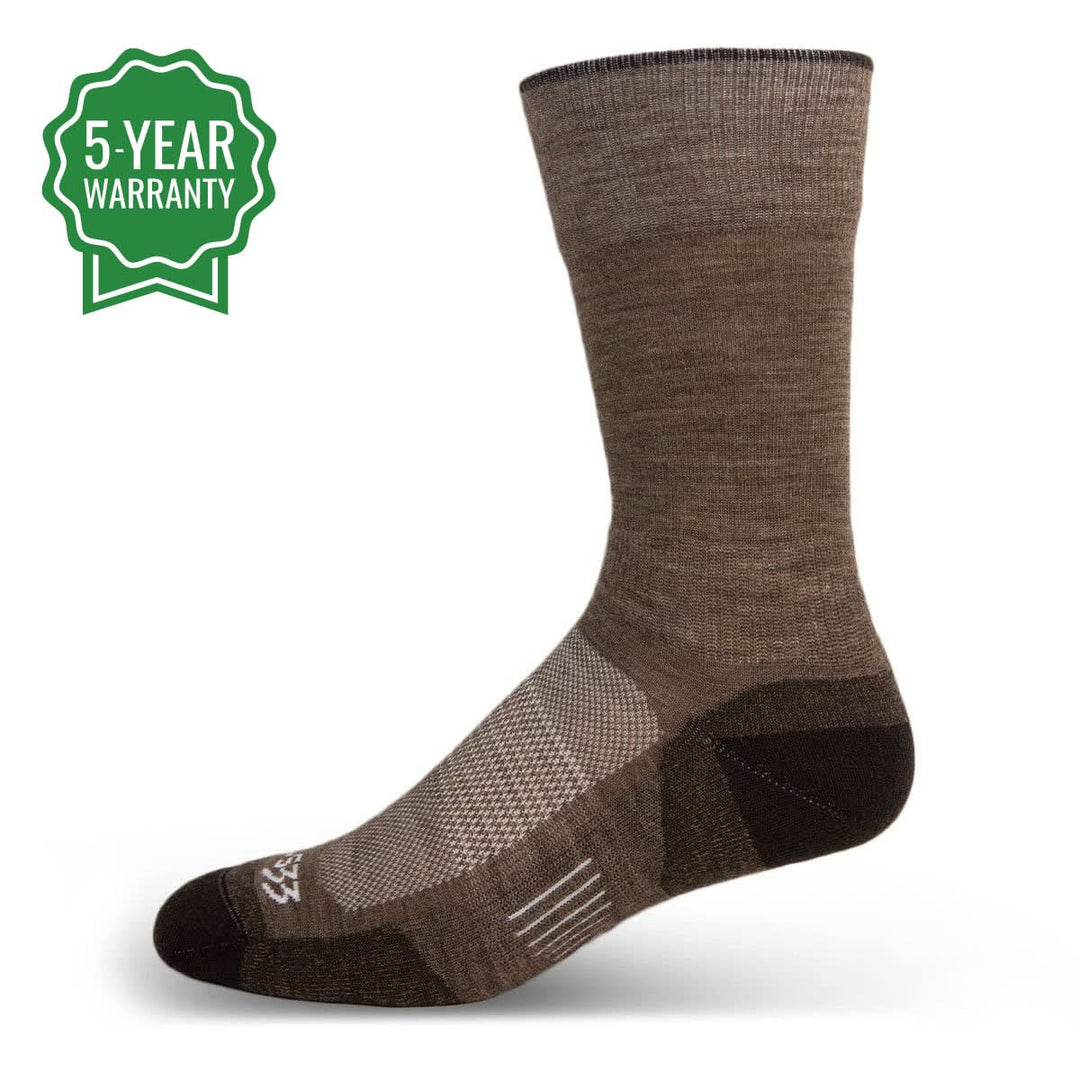 Mountain Heritage Full Cushion Boot Wool Socks - Micro Weight. What compliments a boot better than a Merino Wool sock tailored to match? How about a sock with a full bed of cushioning, vents, and elastic zones? Tailored to match the cut of your boots, this wool sock combines comfort, flexibility, and the lightest feel all in one. Best of all, these socks are silent for when you're in the bunk and out hunting. #color_coffee